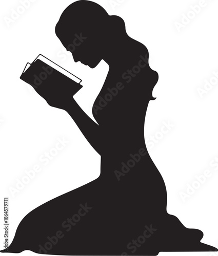 Silhouette of a person kneeling and reading a book