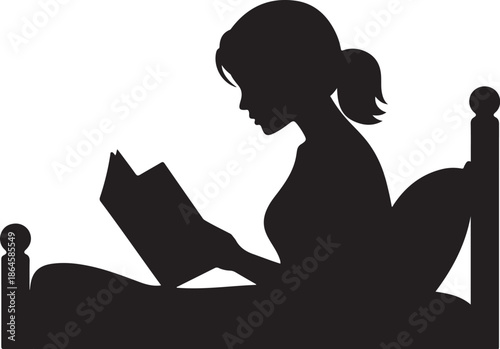 Silhouette of a woman reading a book in bed