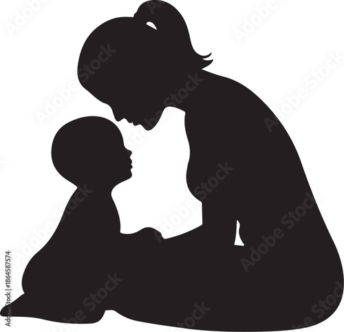 Silhouette of woman and child embracing on the ground
