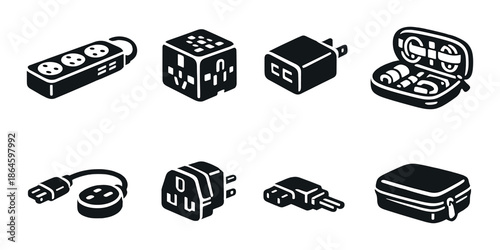 Modern travel adapters and electronic devices essentials on gray background