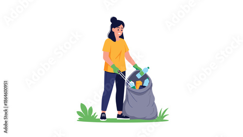 Dedicated woman volunteer wearing gloves while collecting litter and putting plastic waste into a large grey trash bag.
