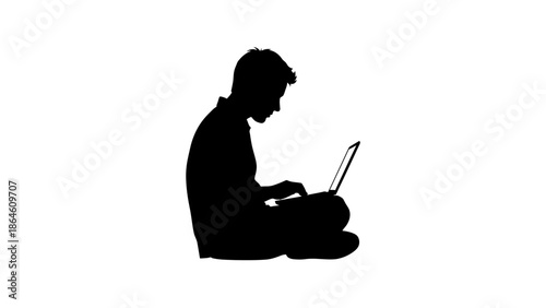 Slika na platnu Silhouette of a young man sitting cross-legged and working on a laptop isolated on white background
