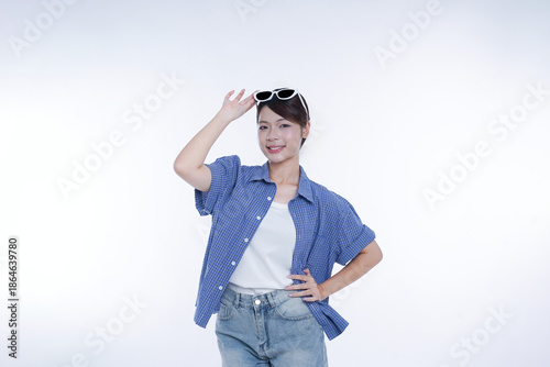 The young girl is photographed against a white background