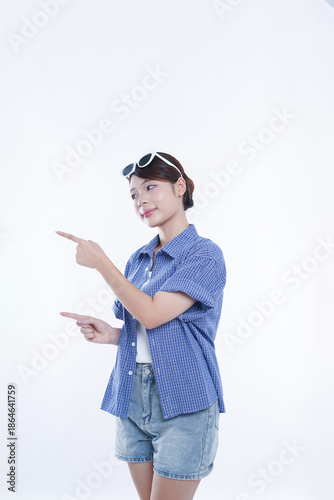 The young girl is photographed against a white background