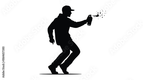 A man spraying paint with dynamic motion a striking silhouette