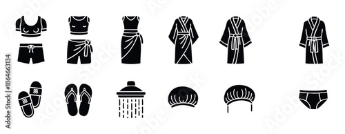 A collection of essential glyph icons depicting swimwear, bathrobes, slippers, and personal care items for travel, vacation, and spa related graphic user interface and application symbols.