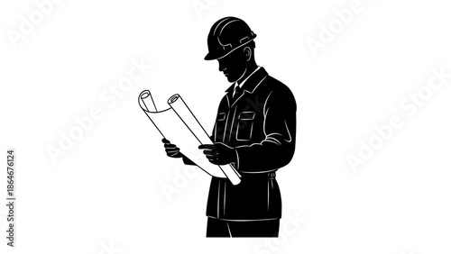 Construction worker reviewing building plans on site