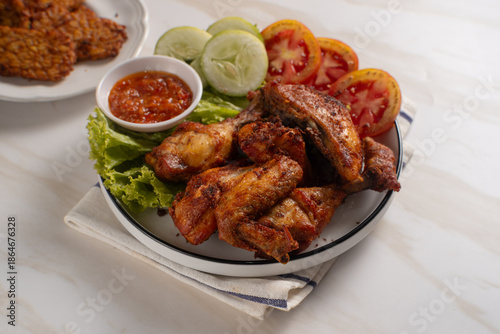 Ayam Goreng Lengkuas Kremes or Galangal Fried Chicken, One of Indonesia's culinary icons. Perfect for recipes, articles or any cooking content.