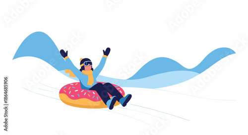Joyful person wearing winter clothes and goggles sliding down a snowy hill on a colorful donut-shaped snow tube during winter.
