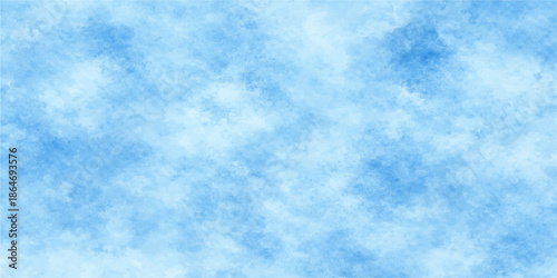 A beautiful clear blue sky with fluffy white cumulus clouds creates a natural summer cloudscape and a bright sunny atmosphere on a peaceful day