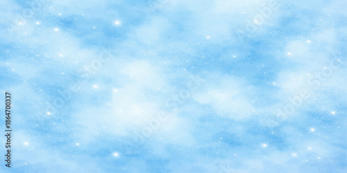 A beautiful abstract blue winter sky with bright white fluffy clouds creates a natural heaven atmosphere for a clear and light Christmas background