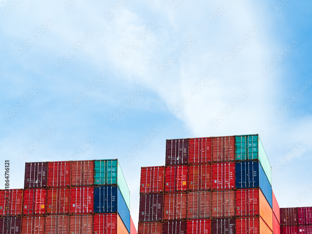 Fototapeta premium argo ship container goods export import international transport on blue sky background, warehouse industry business logistics transportation harbor port industrial shipping terminal cargo ship.