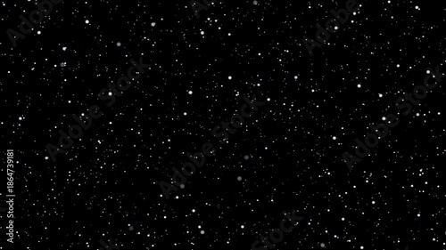 falling snow flakes looping black background 