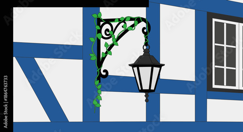 An illustrative depiction of a traditional European half-timbered house facade, featuring a charming black lantern hanging from an ornate bracket adorned with green ivy.
