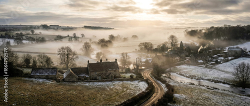 Cinematic Winter Morning Fog Over Rural Village Landscape