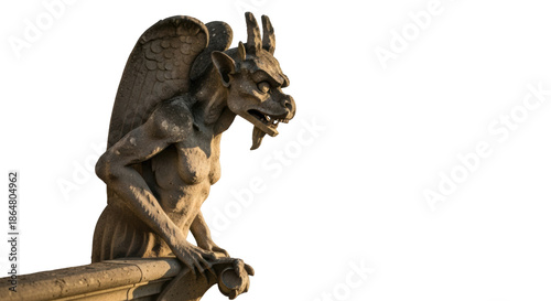 Stone gargoyle sculpture with wings on ledge against black background statue mythical creature
