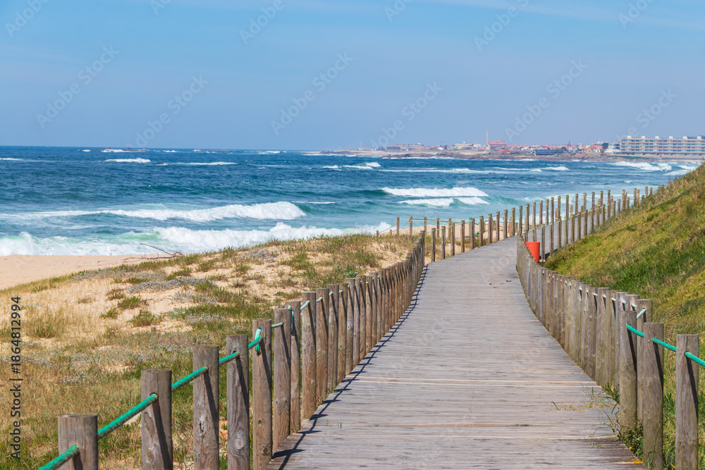 Fototapeta premium Wooden boardwalk along the Atlantic ocean coast, Portugal