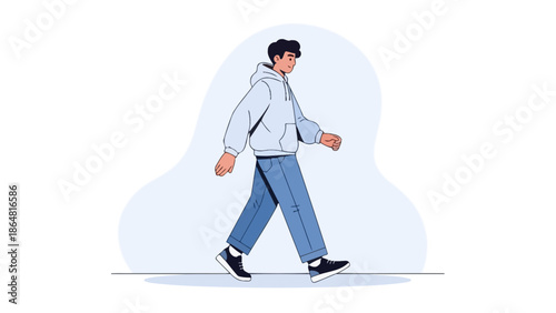 Casual young man walking outdoors wearing a light gray hoodie and blue jeans