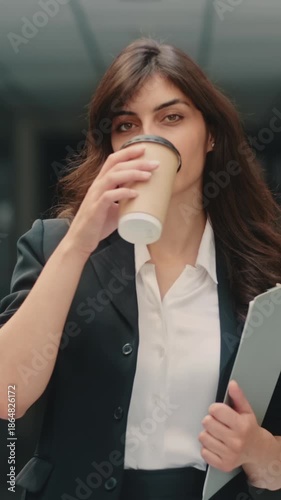 Wallpaper Mural Empowered confident woman walking with coffee showing motivation success independence leadership and ambition symbolizing career growth modern female empowerment financial freedom concept Torontodigital.ca