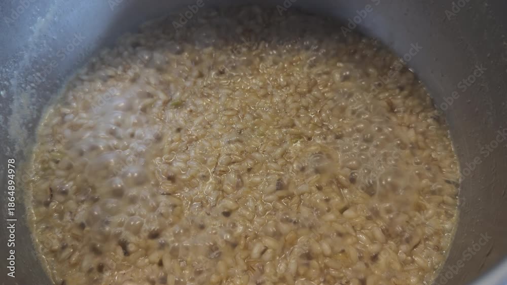 custom made wallpaper toronto digitalBoiling grains cooking in metal pot closeup view