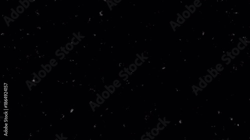 Noise, dirt, dust, scratches and grain on old damaged film surface. Old film look, tv signal with white bad interference, static noise background. Black background. 4K