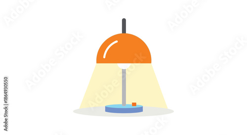 Bright orange desk lamp illuminating a workspace with warm light