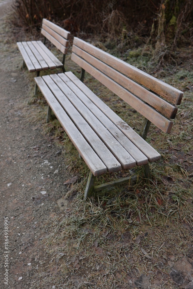 Fototapeta premium Frosty Wooden Benches in Winter Park