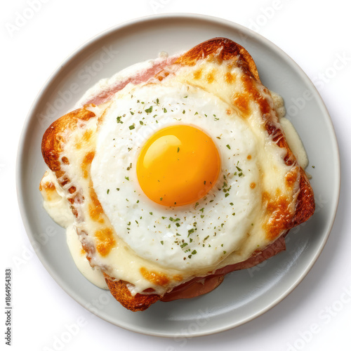 Appetizing Croque Madame sandwich with grilled ham, cheese, fried egg and bechamel sauce from top view