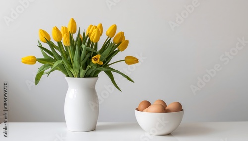 Yellow Tulips in a White Pitcher With Brown Eggs on a Table Setting During Sp...