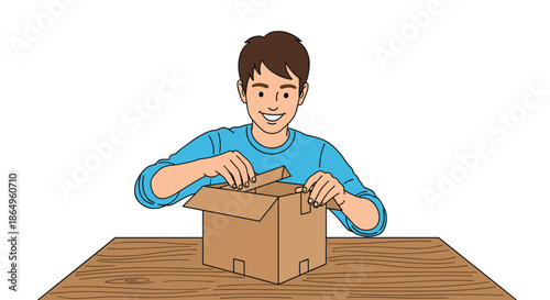 Happy young man smiling with excitement as he sits at a table and opens a cardboard delivery box, enjoying his new purchase.