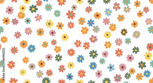 Seamless pattern of scattered colorful ditsy flowers in a retro groovy style, creating a cheerful and playful floral background.