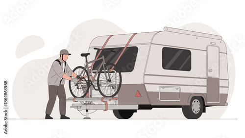 Preparing For Camping Trip: Man Securing Bike to Caravan Rack For Travel
