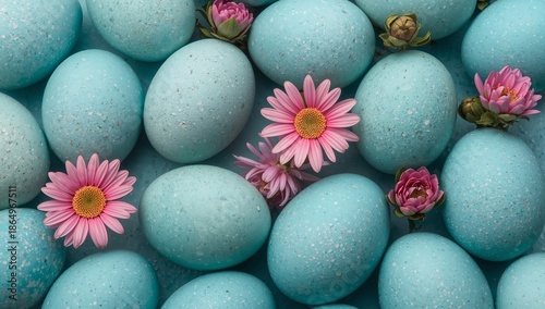 Colorful Blue Eggs Arranged With Flowers on a Flat Surface During Spring Season
