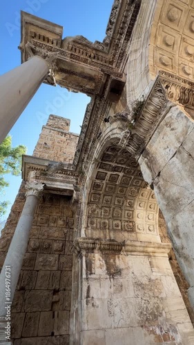 Elements of Hadrian Gate in Antalya with ancient Roman arch and carved stonework.