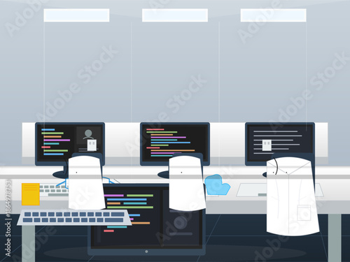 Team workspace with multiple computer screens and coding activity in a modern office environment