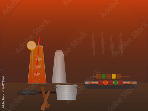 Lemon drink and colorful skewers near cooking equipment at a dinner setting in the evening