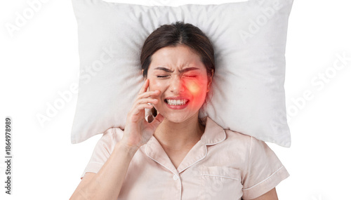 Overhead view of a female resting on white bedding with a visible jaw clench illuminated cheek area symbolizing teeth grinding pain set against a clean white backdrop.