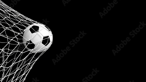 Soccer ball hits the back of the net in a goal on a dark background  sport