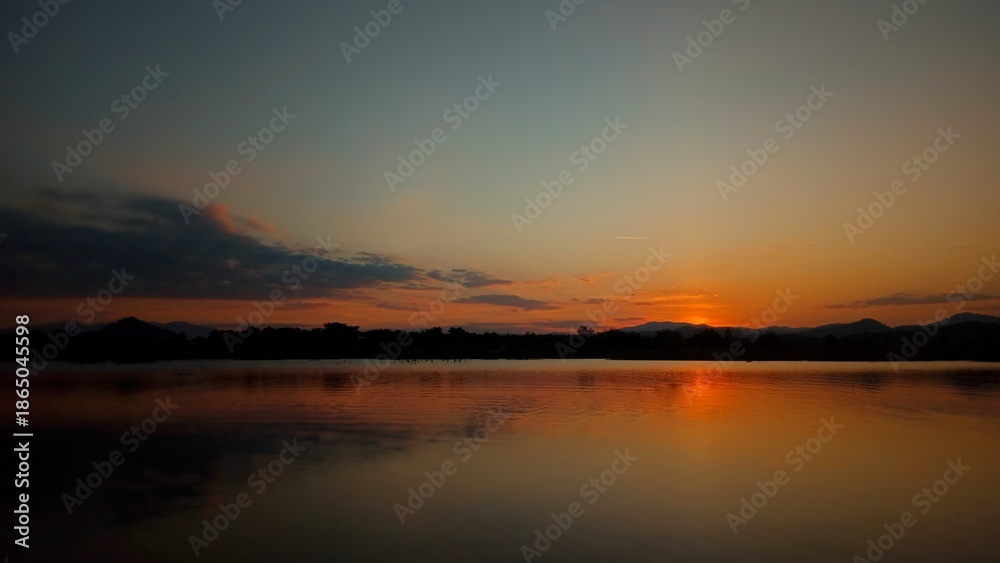 Obraz premium sunset over the river