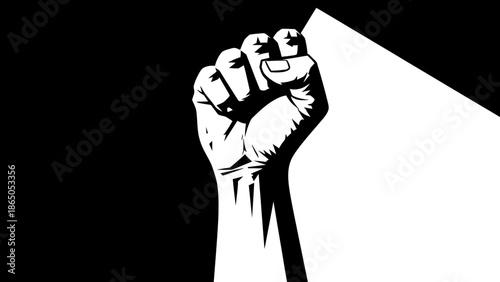 Raised Clenched Fist in a Spotlight on Dark Background Symbolizing Protest and Power