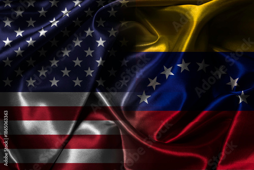 Split waving fabric flags representing USA versus Venezuela symbolizing political tension economic conflict international relations sanctions diplomacy power struggle and global geopolitical concept