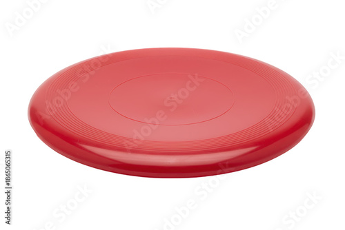 A Vivid Red Frisbee Resting on a Smooth Surface Under Soft Lighting Conditions