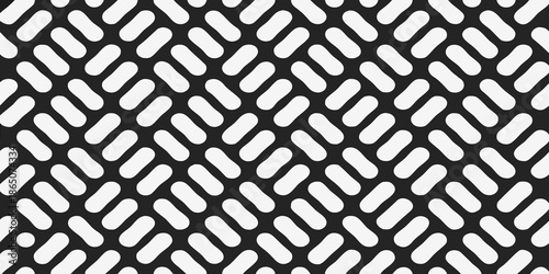 A repeating pattern of diagonal pill shaped forms in black and white
