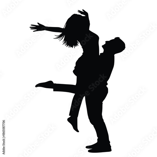 Silhouette of a joyful man lifting a delighted woman high into the air capturing a moment of pure romantic celebration.
