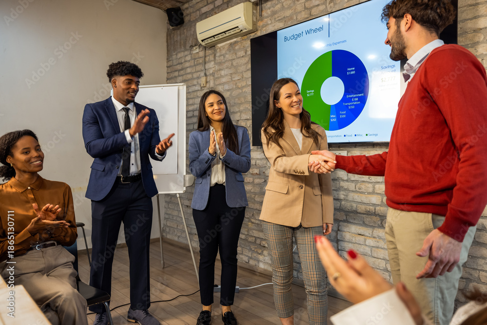 Fototapeta premium Young businessman shaking hands with colleague