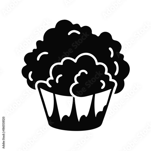 Deliciously fluffy cupcake or muffin with a classic wrapper in a charming silhouette style