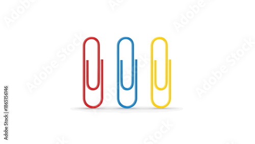 Three colorful metallic fasteners on a stark white background. A red, blue, and yellow object are presented with soft shadows