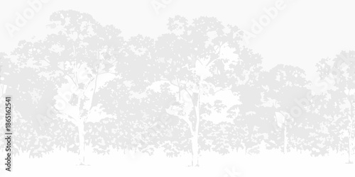 Silhouetted trees against a bright washed out background creating a minimalist scene