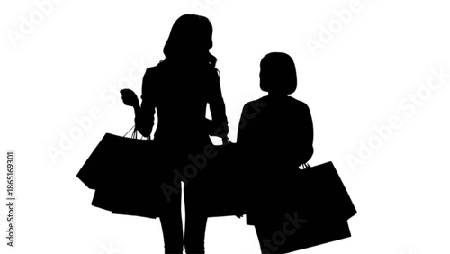 Two women silhouettes with shopping bags enjoying a successful day of retail therapy