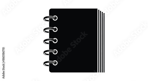 a black spiral bound notebook with metal rings is prominently displayed as a striking silhouette